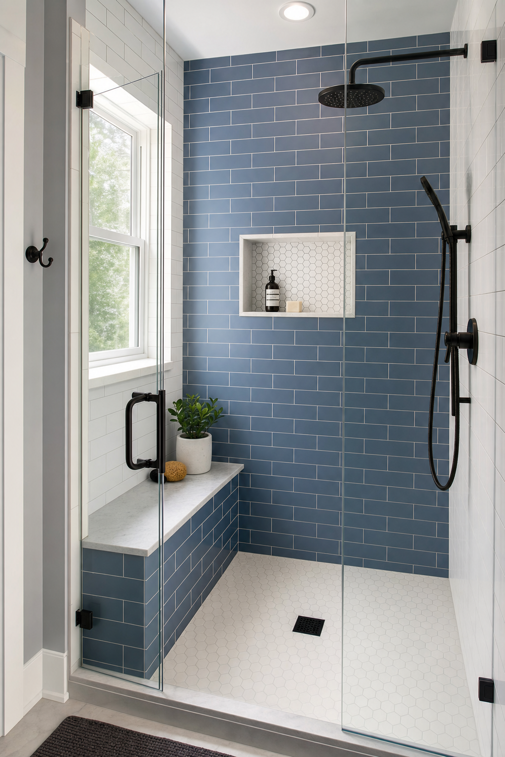 Newly converted walk-in shower with frameless glass enclosure and slate-blue subway tile